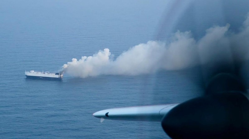 Smoke rises from a fire aboard the cargo vessel Morning Midas, carrying around 3,000 vehicles, including 800 electric vehicles, as seen in an aerial photograph taken from a U.S. Coast Guard C-130J Super Hercules, approximately 300 miles south of Adak, Alaska, U.S. June 3, 2025.  U.S. Coast Guard/Air Station Kodiak/Handout via REUTERS.  THIS IMAGE HAS BEEN SUPPLIED BY A THIRD PARTY