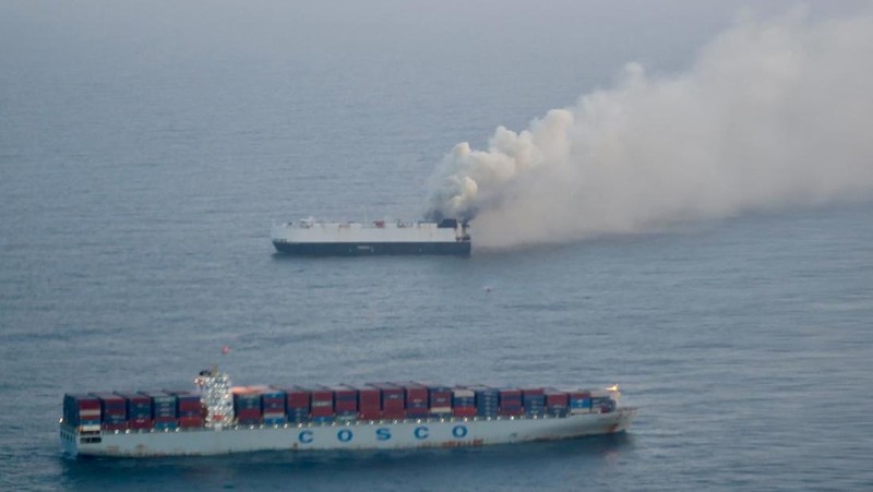 Smoke rises from a fire aboard the cargo vessel Morning Midas, carrying around 3,000 vehicles, including 800 electric vehicles, as seen in an aerial photograph taken from a U.S. Coast Guard C-130J Super Hercules, approximately 300 miles south of Adak, Alaska, U.S. June 3, 2025.  U.S. Coast Guard/Air Station Kodiak/Handout via REUTERS.  THIS IMAGE HAS BEEN SUPPLIED BY A THIRD PARTY