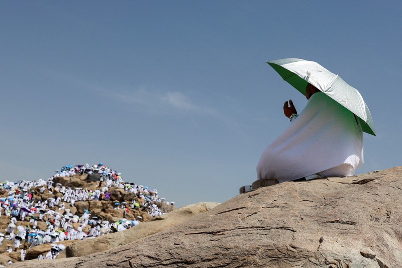 Muslim pilgrims gather at Jabal al-Rahmah, also known as Mount Arafat, during the annual hajj pilgrimage, outside the holy city of Mecca, Saudi Arabia, June 5, 2025. REUTERS/Khaled Abdullah