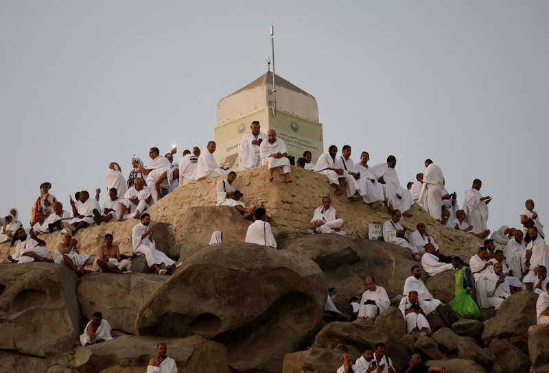 Muslim pilgrims gather at Jabal al-Rahmah, also known as Mount Arafat, during the annual hajj pilgrimage, outside the holy city of Mecca, Saudi Arabia, June 5, 2025. REUTERS/Khaled Abdullah