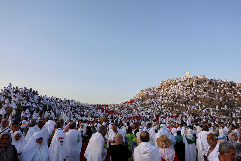 Muslim pilgrims gather at Jabal al-Rahmah, also known as Mount Arafat, during the annual hajj pilgrimage, outside the holy city of Mecca, Saudi Arabia, June 5, 2025. REUTERS/Khaled Abdullah