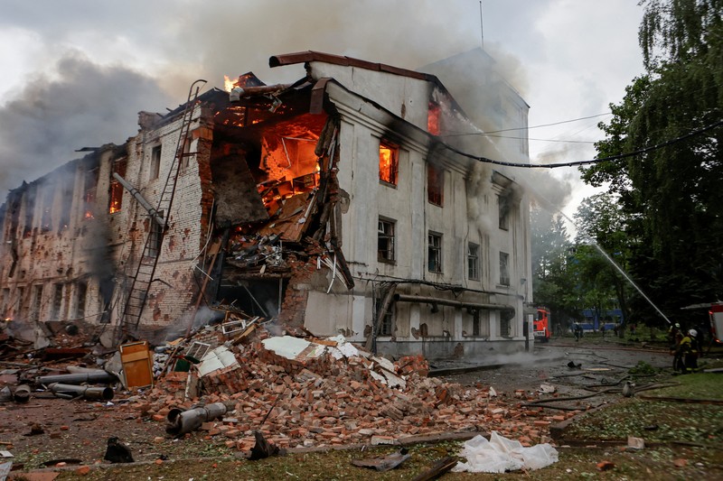 UKRAINE-CRISIS/ATTACK-KHARKIV Firefighters work at the site of a building hit by a Russian drone strike, amid Russia's attack on Ukraine, in Kharkiv, Ukraine June 7, 2025. REUTERS/Sofiia Gatilova TPX IMAGES OF THE DAY