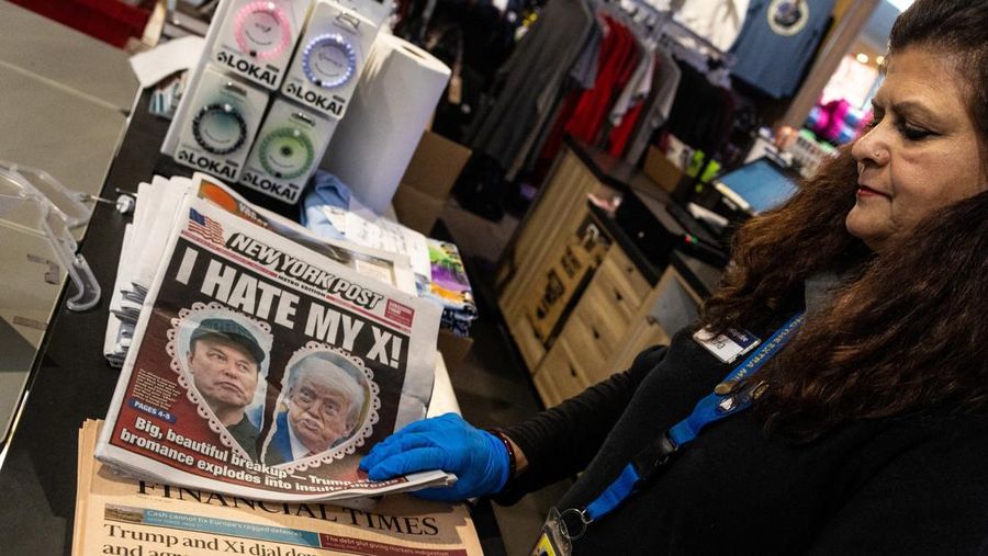 A newspaper front page featuring U.S. President Donald Trump and Elon Musk is displayed at a shop at Ronald Reagan Washington National Airport in Arlington, Virginia, U.S., June 6, 2025. REUTERS/Carlos Barria