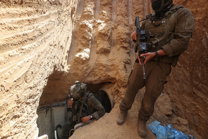 Israeli soldiers walk out from a tunnel underneath the European Hospital in Khan Younis at the Gaza Strip, amid the ongoing ground operation of the Israeli army against Palestinian Islamist group Hamas, June 8, 2025. REUTERS/Ronen Zvulun EDITOR'S NOTE: REUTERS PHOTOGRAPHS WERE REVIEWED BY THE IDF AS PART OF THE CONDITIONS OF THE EMBED. NO PHOTOS WERE REMOVED.