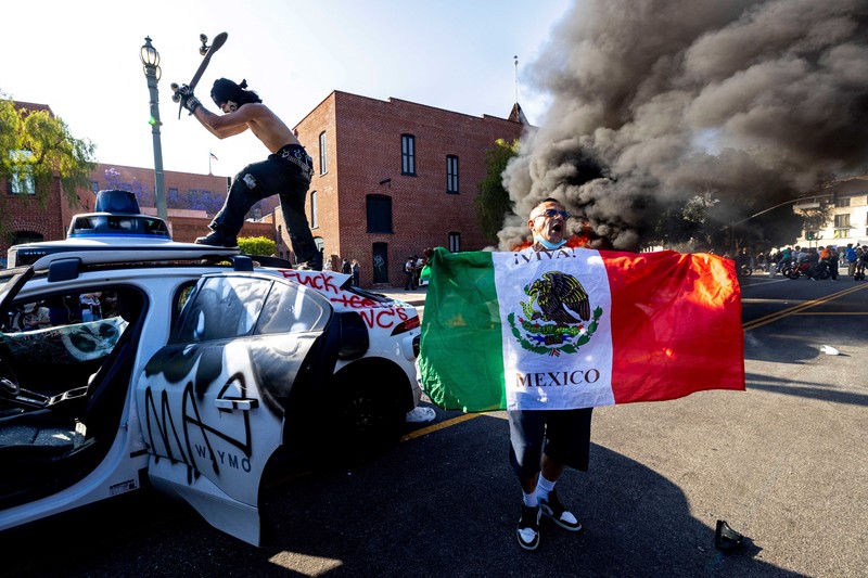 SENSITIVE MATERIAL. THIS IMAGE MAY OFFEND OR DISTURB   Waymo cars burn during a protest against federal immigration sweeps in downtown Los Angeles, California, U.S. June 8, 2025. REUTERS/Daniel Cole     TPX IMAGES OF THE DAY