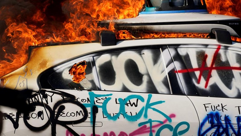 SENSITIVE MATERIAL. THIS IMAGE MAY OFFEND OR DISTURB   Waymo cars burn during a protest against federal immigration sweeps in downtown Los Angeles, California, U.S. June 8, 2025. REUTERS/Daniel Cole     TPX IMAGES OF THE DAY
