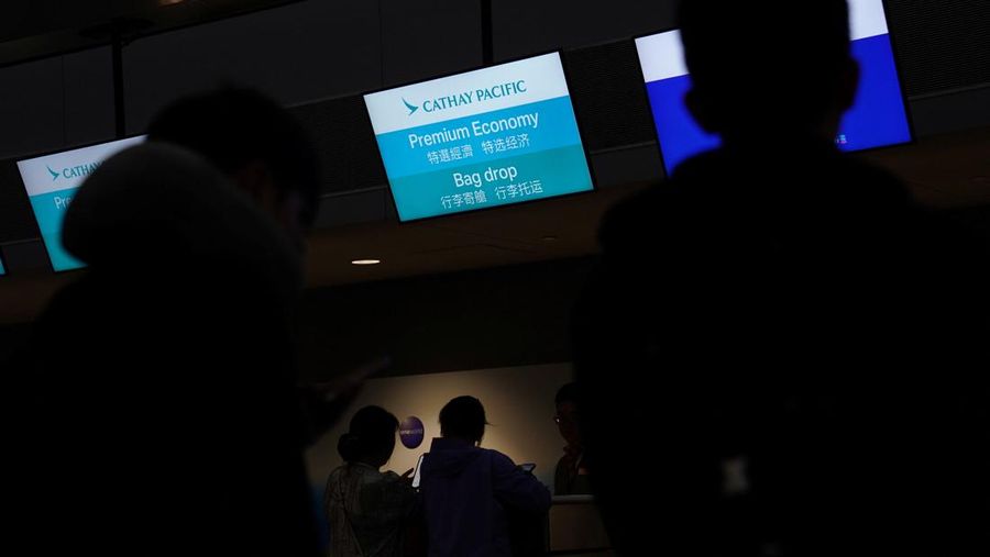 USA-TRAVEL/ A traveler waits for his vehicle at an Uber passenger pick-up area at Terminal 8 at John F. Kennedy International Airport, ahead of U.S. President Donald Trump?s reinstatement of a new travel ban barring citizens of 12 countries from entering the U.S., in New York, U.S., June 8, 2025. REUTERS/Bing Guan