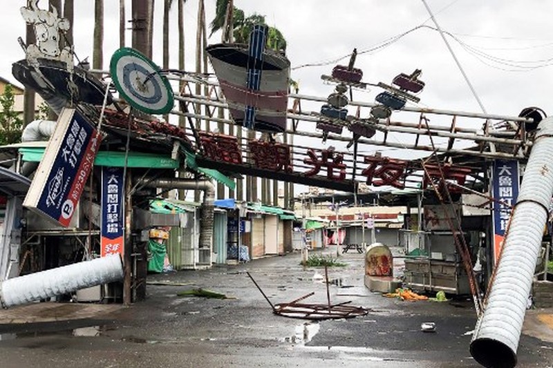 TAIWAN-WEATHER-TYPHOON This picture shows the collapsed archway of Nankunshen Daitian temple and the flooded courtyard in the aftermath of Typhoon Danas in Tainan on July 7, 2025. Typhoon Danas made landfall on the west coast of Taiwan late on July 6, the Central Weather Administration said, dumping torrential rain on the island that triggered flooding and landslides. (Photo by Johnson LIU / AFP)