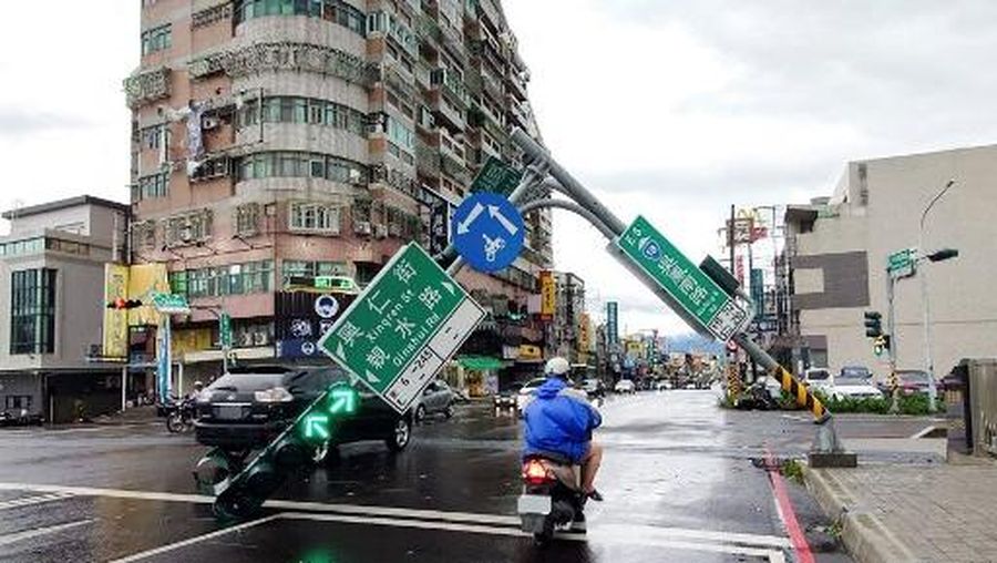 This picture shows the collapsed archway of Nankunshen Daitian temple and the flooded courtyard in the aftermath of Typhoon Danas in Tainan on July 7, 2025. Typhoon Danas made landfall on the west coast of Taiwan late on July 6, the Central Weather Administration said, dumping torrential rain on the island that triggered flooding and landslides. (Photo by Johnson LIU / AFP)