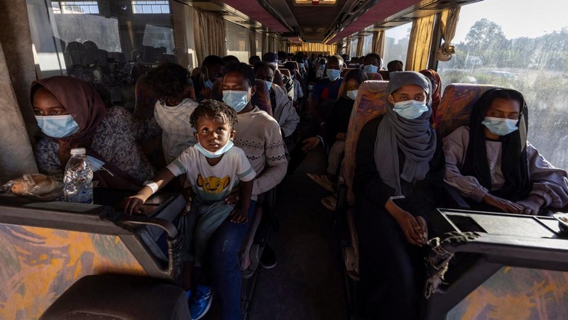 A group of newly-arrived migrants board a ferry bound for Piraeus, mainland Greece, in Souda, on the island of Crete, Greece, July 11, 2025. REUTERS/Nicolas Economou