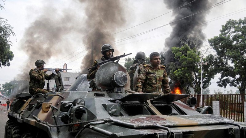 Soldiers sit atop an APC after armed forces were deployed, following a clash during a National Citizen Party rally, in Gopalganj, Bangladesh, July 16, 2025. REUTERS/Anik Rahman