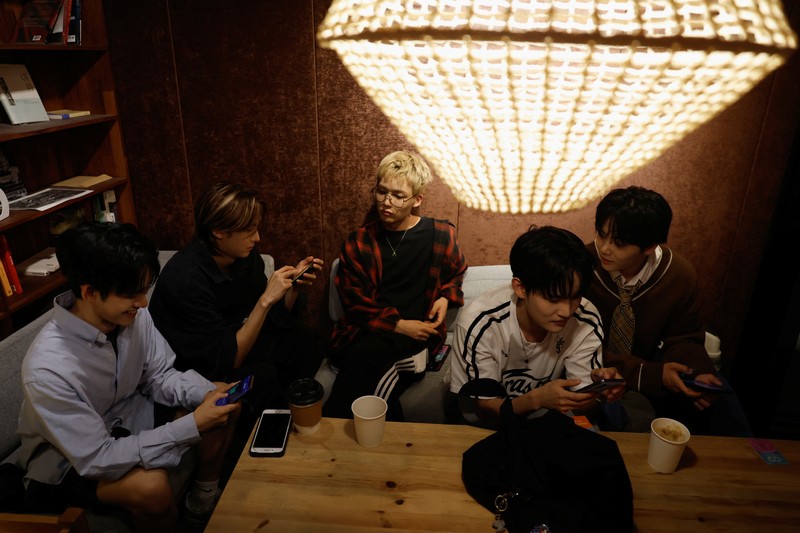 Members of K-pop boy band 1VERSE, including Hyuk and Seok who defected from North Korea, as well as Aito, Nathan and Kenny, perform their new single in front of a camera in Seoul, South Korea, May 21, 2025. REUTERS/Kim Soo-hyeon