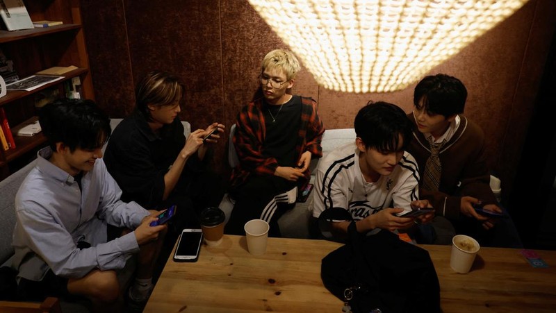 Members of K-pop boy band 1VERSE, including Hyuk and Seok who defected from North Korea, as well as Aito, Nathan and Kenny, perform their new single in front of a camera in Seoul, South Korea, May 21, 2025. REUTERS/Kim Soo-hyeon