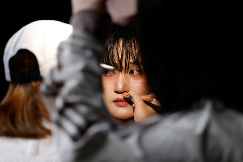 Members of K-pop boy band 1VERSE, including Hyuk and Seok who defected from North Korea, as well as Aito, Nathan and Kenny, perform their new single in front of a camera in Seoul, South Korea, May 21, 2025. REUTERS/Kim Soo-hyeon