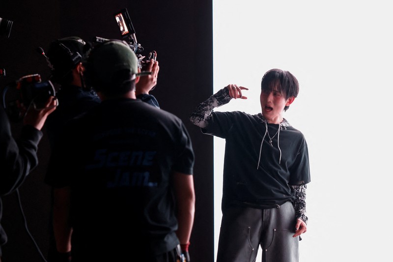 Members of K-pop boy band 1VERSE, including Hyuk and Seok who defected from North Korea, as well as Aito, Nathan and Kenny, perform their new single in front of a camera in Seoul, South Korea, May 21, 2025. REUTERS/Kim Soo-hyeon