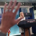 A hand is raised as White House Press Secretary Karoline Leavitt speaks during a press briefing at the White House in Washington, D.C., U.S., July 17, 2025. REUTERS/Nathan Howard
