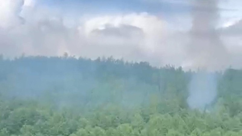 Smoke rises at the crash site of an Angara Airlines An-24 passenger plane near Tynda in the Amur Region, Russia July 24, 2025, in this still image taken from video. Federal Air Transport Agency/Handout via REUTERS ATTENTION EDITORS - THIS IMAGE HAS BEEN SUPPLIED BY A THIRD PARTY. NO RESALES. NO ARCHIVES. MANDATORY CREDIT.