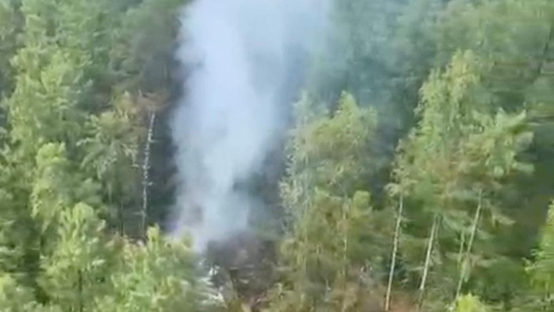 Smoke rises at the crash site of an Angara Airlines An-24 passenger plane near Tynda in the Amur Region, Russia July 24, 2025, in this still image taken from video. Federal Air Transport Agency/Handout via REUTERS ATTENTION EDITORS - THIS IMAGE HAS BEEN SUPPLIED BY A THIRD PARTY. NO RESALES. NO ARCHIVES. MANDATORY CREDIT.