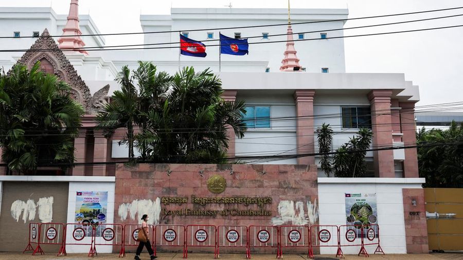 A woman walks past the Royal Embassy of Cambodia, after Thailand recalled its ambassador to Cambodia and said it would expel Cambodia's ambassador, following a landmine incident that injured Thai soldiers and recent clashes along the disputed border between the two countries, in Bangkok, Thailand, July 24, 2025. REUTERS/Chalinee Thirasupa