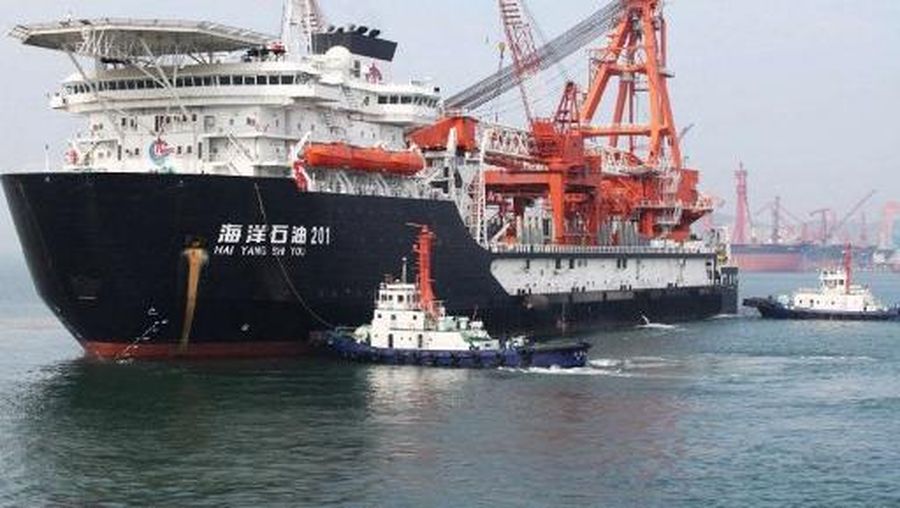 This picture taken on May 21, 2012 shows the departure of China National Offshore Oil Corp. (CNOOC)'s first independent deep-water oil drilling rig, from the port of Qingdao, east China's Shandong province. China's first home-grown deep-water drilling rig will be located in the South China Sea, some 300 kilometres (200 miles) southeast of Hong Kong, as the country's dependent on oil imports to fuel its surging economy, claims full sovereignty on the sea, which has huge oil and gas reserves, often leading to diplomatic rows with its neighbours. CHINA OUT AFP PHOTO (Photo by AFP)