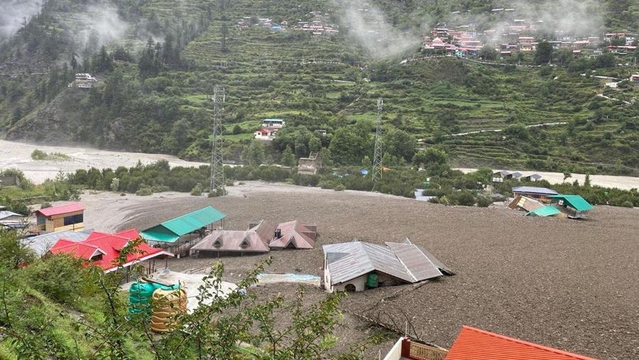 Houses are partially buried by a mudslide, amid flash floods, in Dharali, Uttarakhand, India, August 5, 2025. Indian Army Central Command via X/Handout via REUTERS THIS IMAGE HAS BEEN SUPPLIED BY A THIRD PARTY. MANDATORY CREDIT. NO RESALES. NO ARCHIVES. TPX IMAGES OF THE DAY VERIFICATION Reuters was able to confirm the location by buildings and terrain which matched file and satellite imagery. The date was verified by official and local media reports of flash flood in the area on Tuesday (August 5).
