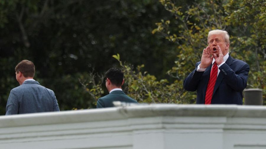 U.S. President Donald Trump jokes to reporters that he's planning to install nuclear missiles, on a walk with an architect and aides on the roof of the White House in Washington, D.C., U.S., August 5, 2025. REUTERS/Jonathan Ernst TPX IMAGES OF THE DAY