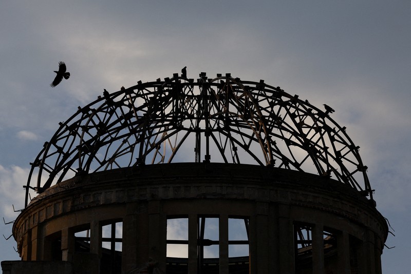 WW2-ANNIVERSARY/HIROSHIMA A crow flies over the dome, a day ahead of the 80th anniversary of the World War Two atomic bombing in Hiroshima, western Japan, August 5, 2025. REUTERS/Kim Kyung-Hoon TPX IMAGES OF THE DAY