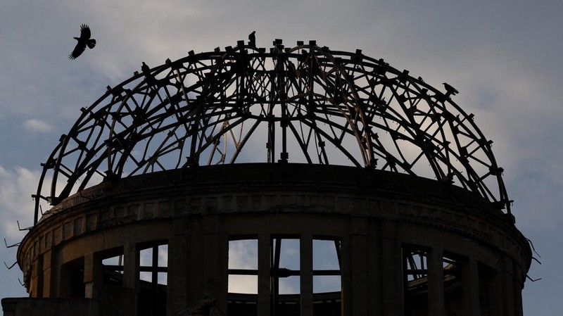 A crow flies over the dome, a day ahead of the 80th anniversary of the World War Two atomic bombing in Hiroshima, western Japan, August 5, 2025. REUTERS/Kim Kyung-Hoon     TPX IMAGES OF THE DAY