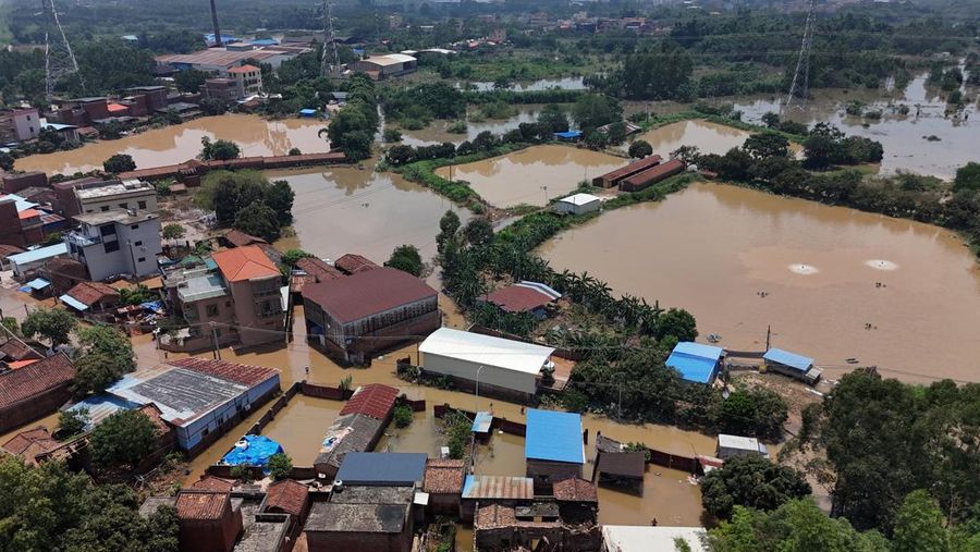 A drone view shows a house that partially collapsed after days of heavy rainfall, at a flooded section of the village in Qingyuan, Guangdong province, China August 8, 2025. REUTERS/Florence Lo