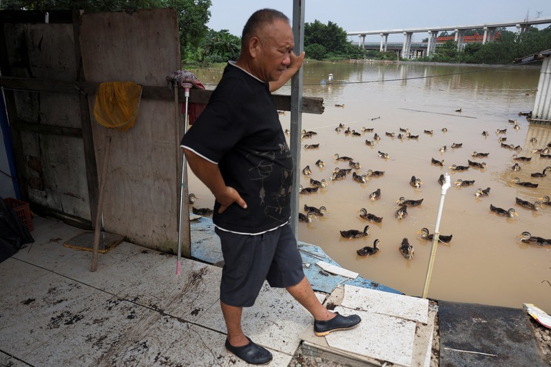 ASIA-WEATHER/CHINA A drone view shows a house that partially collapsed after days of heavy rainfall, at a flooded section of the village in Qingyuan, Guangdong province, China August 8, 2025. REUTERS/Florence Lo