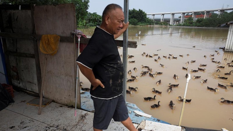 A drone view shows a house that partially collapsed after days of heavy rainfall, at a flooded section of the village in Qingyuan, Guangdong province, China August 8, 2025. REUTERS/Florence Lo