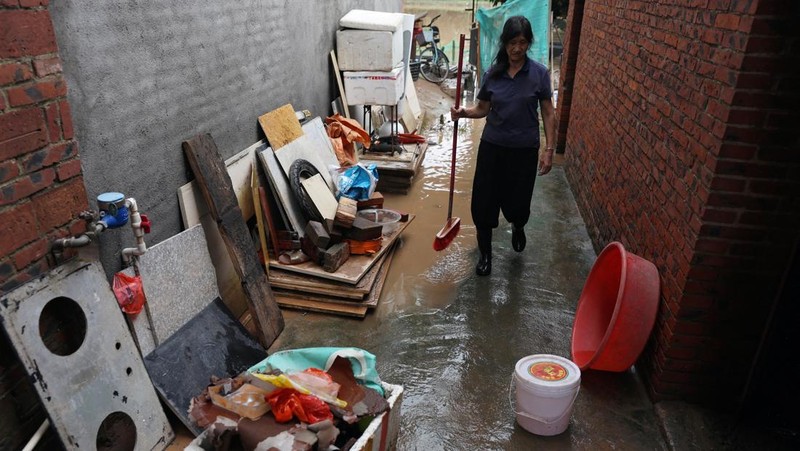A drone view shows a house that partially collapsed after days of heavy rainfall, at a flooded section of the village in Qingyuan, Guangdong province, China August 8, 2025. REUTERS/Florence Lo