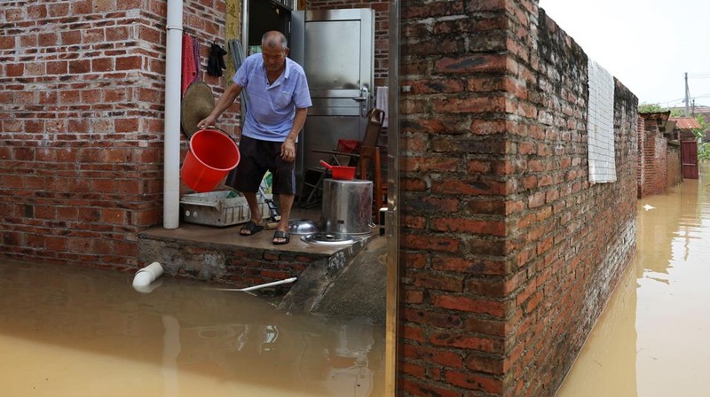 A drone view shows a house that partially collapsed after days of heavy rainfall, at a flooded section of the village in Qingyuan, Guangdong province, China August 8, 2025. REUTERS/Florence Lo