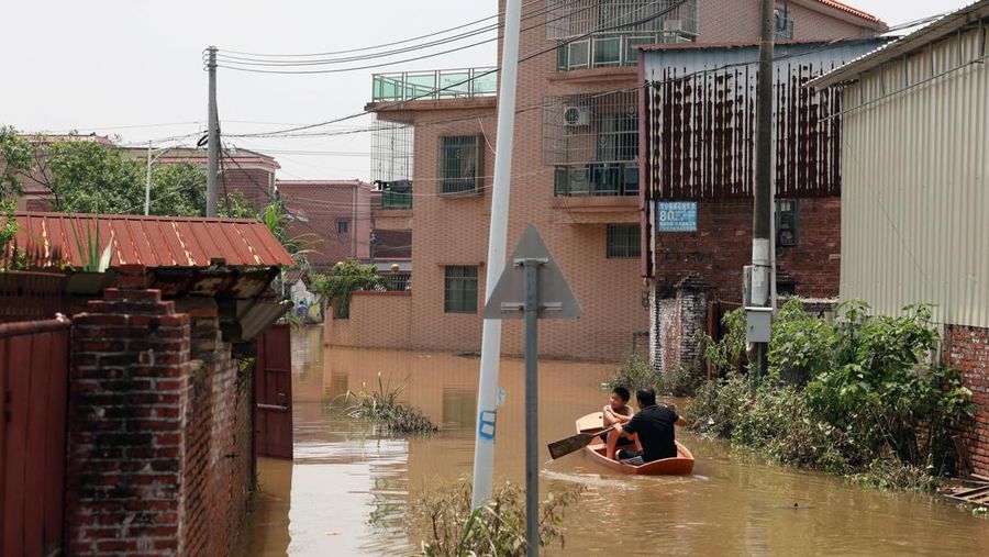A drone view shows a house that partially collapsed after days of heavy rainfall, at a flooded section of the village in Qingyuan, Guangdong province, China August 8, 2025. REUTERS/Florence Lo