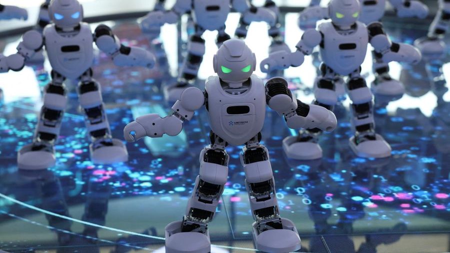 A staff member works at a section selling Robot World merchandise, during an organised media tour to Robot Mall, a store selling humanoid and other robots, in Beijing, China August 6, 2025. REUTERS/Florence Lo