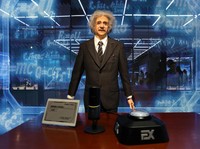 A humanoid robot in the likeness of late physicist Albert Einstein stands behind a price tag, during an organised media tour to Robot Mall, a store selling humanoid and other robots, in Beijing, China August 6, 2025. REUTERS/Florence Lo
