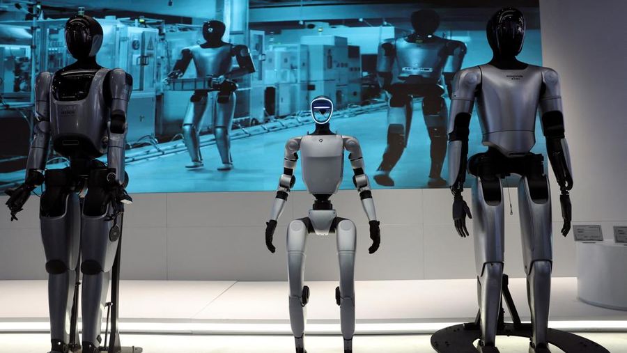 A staff member works at a section selling Robot World merchandise, during an organised media tour to Robot Mall, a store selling humanoid and other robots, in Beijing, China August 6, 2025. REUTERS/Florence Lo