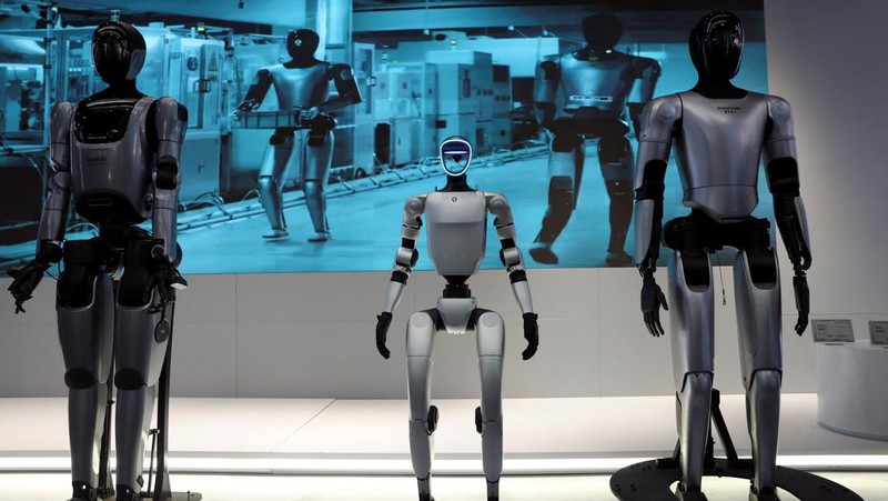 A staff member works at a section selling Robot World merchandise, during an organised media tour to Robot Mall, a store selling humanoid and other robots, in Beijing, China August 6, 2025. REUTERS/Florence Lo