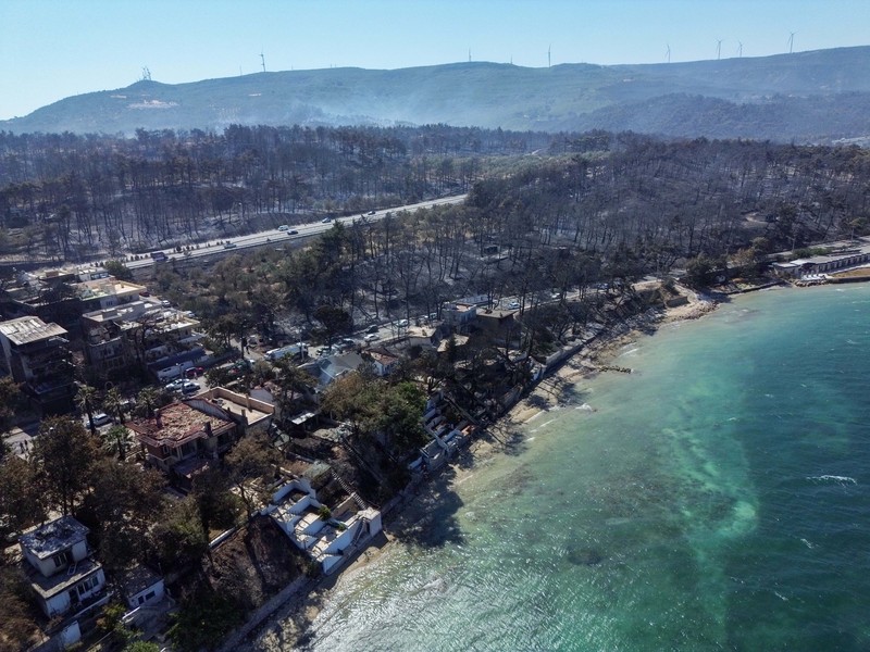 Foto udara menunjukkan dampak akibat kebakaran hutan di dekat Erenkoy, Canakkale, Turki, Selasa (12/8/2025). (REUTERS/Efekan Akyuz) Foto udara menunjukkan dampak akibat kebakaran hutan di dekat Erenkoy, Canakkale, Turki, Selasa (12/8/2025). (REUTERS/Efekan Akyuz)