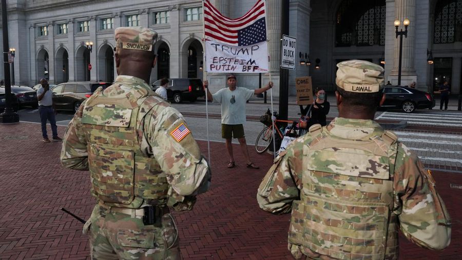 Protestors confront members of the National Guard patrolling Union Station after U.S. President Donald Trump federalized the Metropolitan Police Department under the Home Rule Act and deployed National Guard to assist in crime prevention in the nation’s capital, in Washington, D.C., U.S., August 16, 2025. REUTERS/Alex Kent