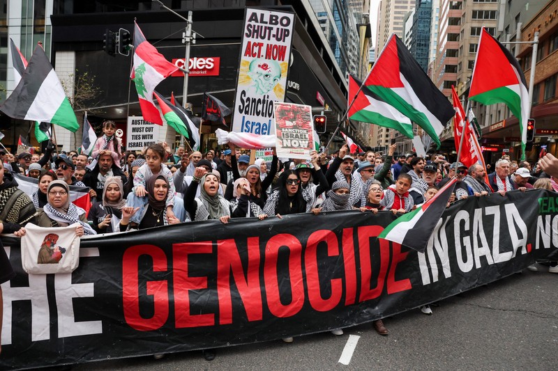 Para demonstranikut serta dalam protes 'Pawai Nasional untuk Palestina' di Sydney, Australia, Minggu (24/8/2025).(REUTERS/Hollie Adams) Para demonstranikut serta dalam protes 'Pawai Nasional untuk Palestina' di Sydney, Australia, Minggu (24/8/2025).(REUTERS/Hollie Adams)