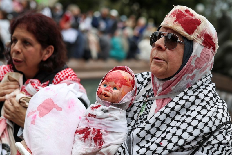 Para demonstranikut serta dalam protes 'Pawai Nasional untuk Palestina' di Sydney, Australia, Minggu (24/8/2025).(REUTERS/Hollie Adams) Para demonstranikut serta dalam protes 'Pawai Nasional untuk Palestina' di Sydney, Australia, Minggu (24/8/2025).(REUTERS/Hollie Adams)