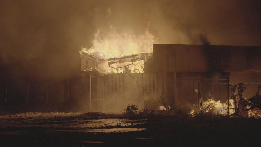 The charred remains of the national parliament of the Marshall Islands, following a fire, in Majuro, Marshall Islands, August 26, 2025, in this screengrab obtained from social media. Chewy Lin/via REUTERS  THIS IMAGE HAS BEEN SUPPLIED BY A THIRD PARTY. MANDATORY CREDIT. NO RESALES. NO ARCHIVES. VERIFICATION: Building structure, signage and the badge on the firefighters match file images. Date verified by the metadata on the file