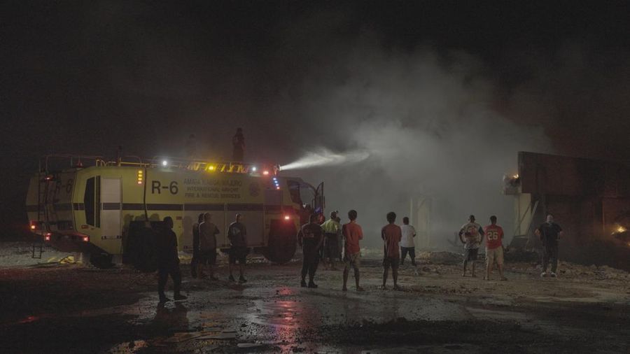 MARSHALLISLANDS-FIRE/ The charred remains of the national parliament of the Marshall Islands, following a fire, in Majuro, Marshall Islands, August 26, 2025, in this screengrab obtained from social media. Chewy Lin/via REUTERS THIS IMAGE HAS BEEN SUPPLIED BY A THIRD PARTY. MANDATORY CREDIT. NO RESALES. NO ARCHIVES. VERIFICATION: Building structure, signage and the badge on the firefighters match file images. Date verified by the metadata on the file