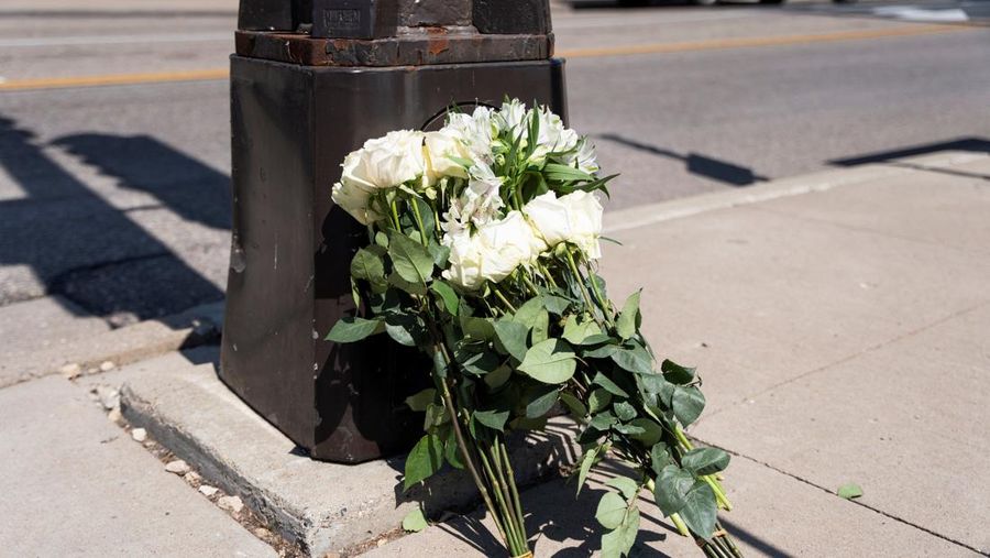Families and loved ones reunite outside the police barricades after a shooting at Annunciation Church, which is also home to an elementary school, in Minneapolis, Minnesota, U.S. August 27, 2025.  REUTERS/Ben Brewer