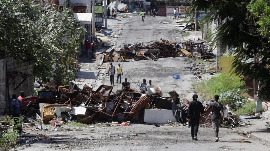 Residents return to the Delmas 30 neighborhood after gang leader Jimmy "Barbeque" Cherizier withdrew his soldiers from several neighborhoods in northeastern Port-au-Prince and urged former residents to return to their homes, in Port-au-Prince, Haiti August 27, 2025. REUTERS/Jean Feguens Regala