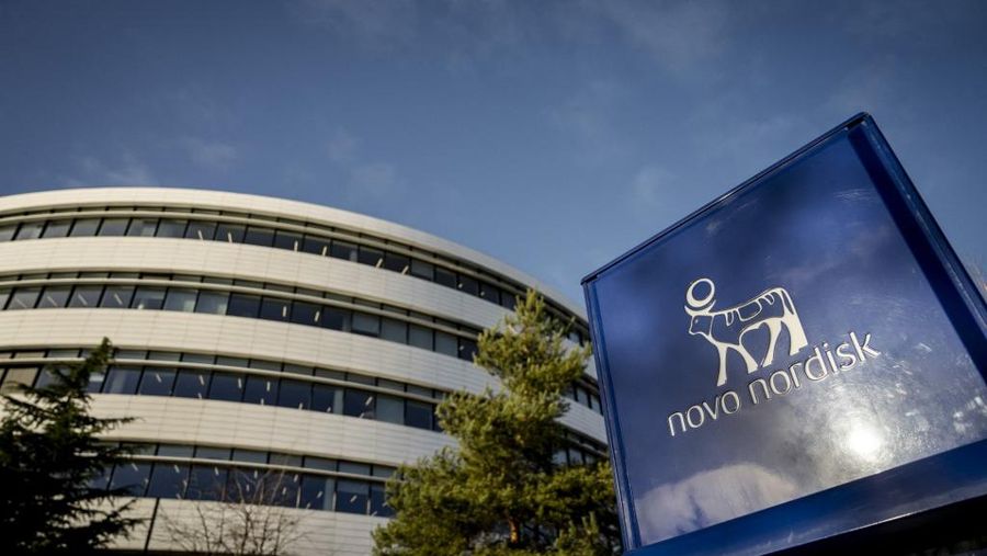 (FILES) The logos of Danish drugmaker Novo Nordisk, maker of the blockbuster diabetes and weight-loss treatments Ozempic and Wegovy is seen outside theri building as the company presents the annual report at Novo Nordisk in Bagsvaerd, Denmark, on February 5, 2025. Danish pharmaceutical giant Novo Nordisk announced on September 10, 2025 that it would cut 9,000 jobs worldwide. (Photo by Mads Claus Rasmussen / Ritzau Scanpix / AFP) / Denmark OUT