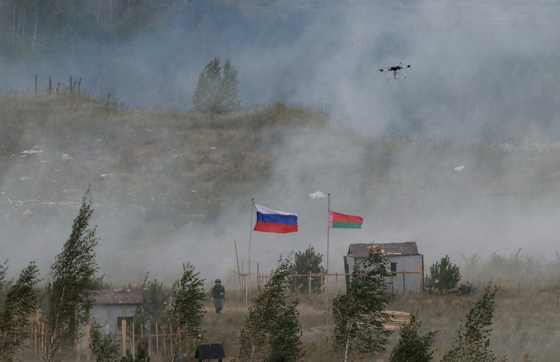 Russian and Belarusian flags fly at a training ground during the joint Russia-Belarus 