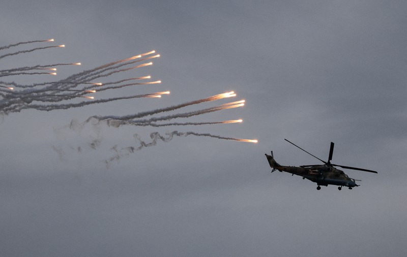 BELARUS-RUSSIA/DRILLS Russian and Belarusian flags fly at a training ground during the joint Russia-Belarus