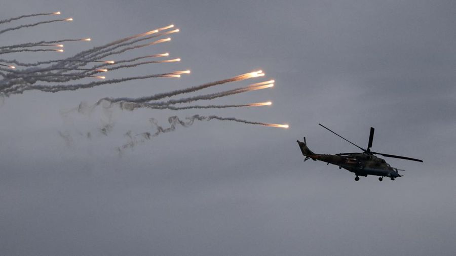 BELARUS-RUSSIA/DRILLS Russian and Belarusian flags fly at a training ground during the joint Russia-Belarus